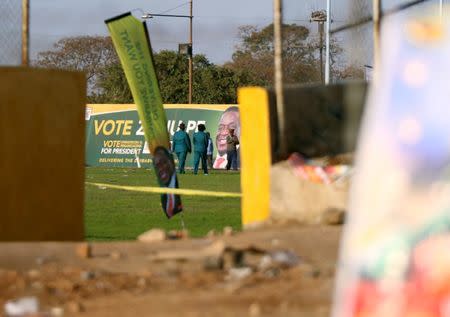 Police officers are seen at the White City Stadium, where Zimbabwe President Emmerson Mnangagwa escaped unhurt after an explosion rocked the stadium, in Bulawayo, Zimbabwe, June 23,2018. REUTERS/Philimon Bulawayo