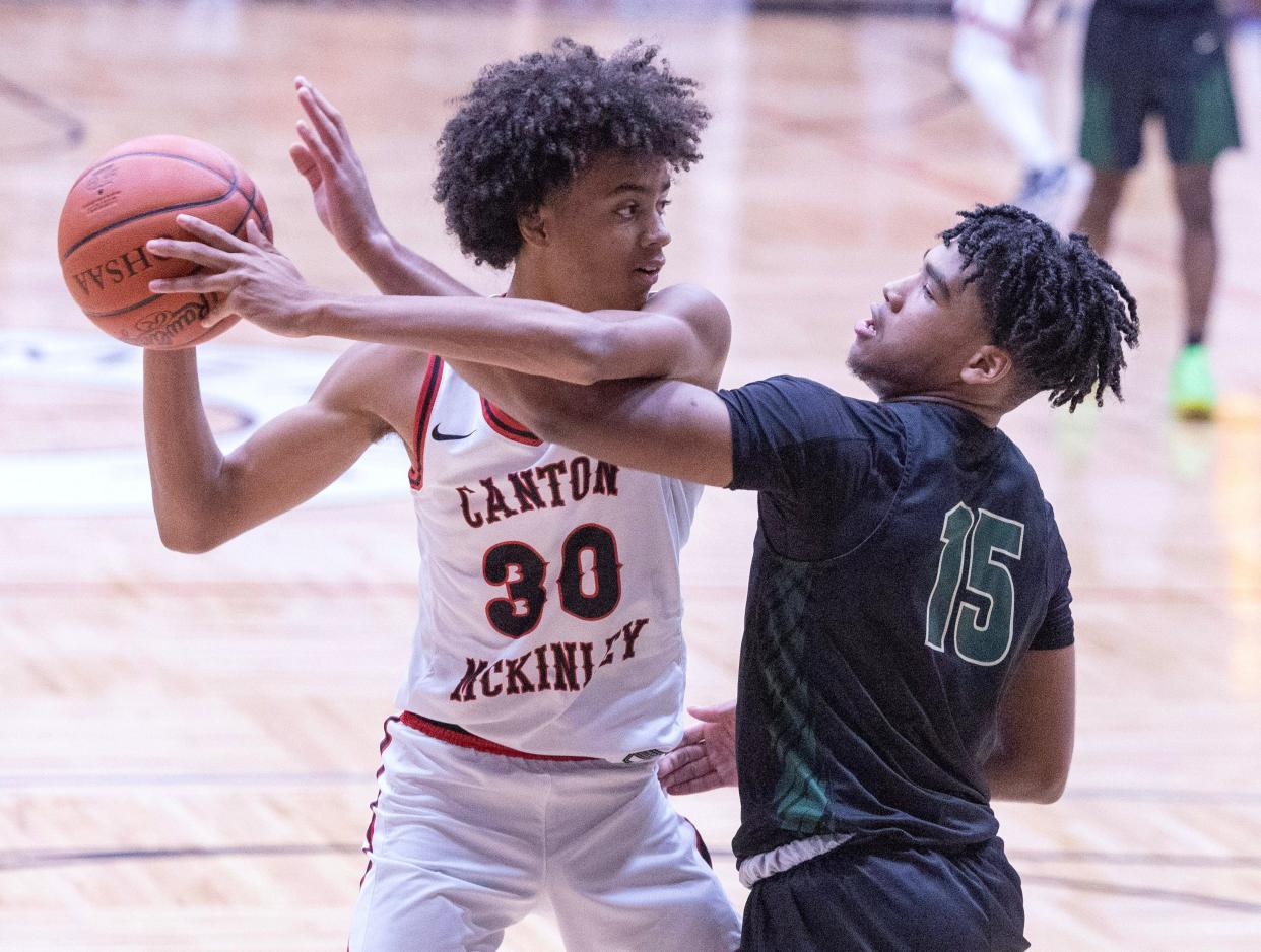 McKinley's Reed Sims, in action against GlenOak in January, scored 21 points Saturday to help the Bulldogs set up a third game against GlenOak this season..