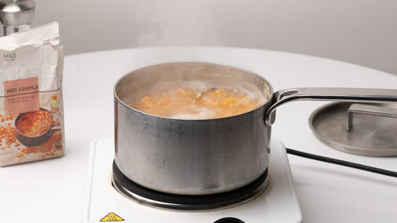 lentils cooking in a saucepan