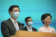 From right, Hong Kong's Chief Executive Carrie Lam, Secretary for Security Chris Tang and Chief Secretary John Lee attend a news conference in Hong Kong, Friday, June 25, 2021. China on Friday promoted Hong Kong's top security official to the territory's No. 2 spot as Beijing continues to clamp down on free speech and political opposition. (AP Photo/Kin Cheung)