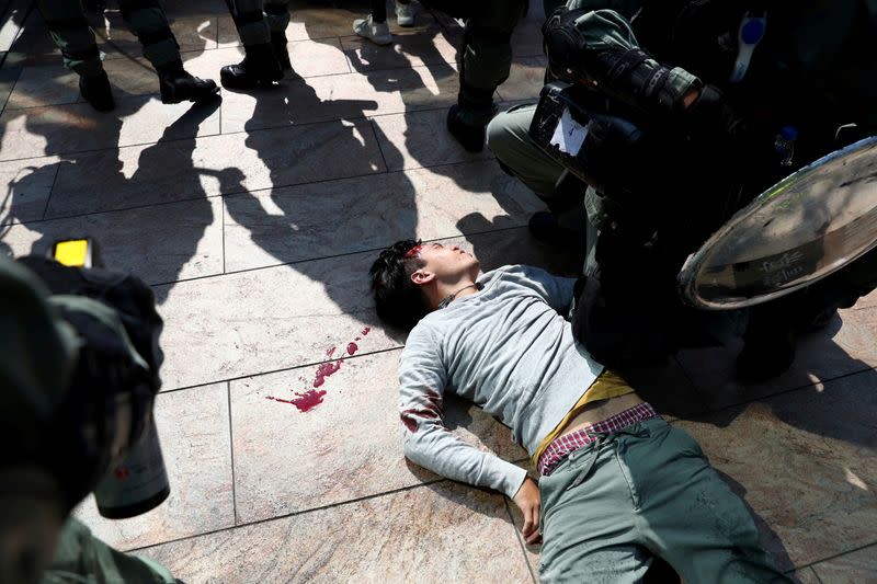 Pictures of the Year: Hong Kong protest tide turns into sea of flames