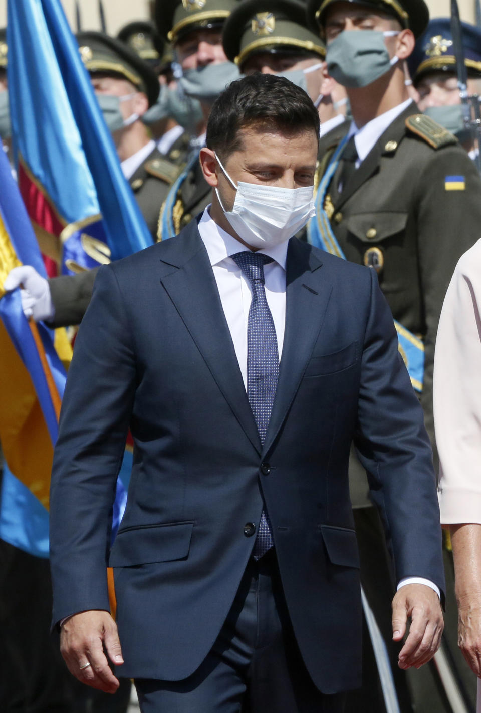 FILE - In this file photo dated Tuesday, July. 21, 2020, Ukrainian President Volodymyr Zelenskiy reviews the honor guard during a welcome ceremony in Kyiv, Ukraine. It is announced Monday Nov. 9, 2020, that Volodymyr Zelenskiy has tested positive for the COVID-19 coronavirus.(AP Photo/Efrem Lukatsky, FILE)