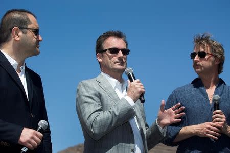 Hyperloop One CEO Rob Lloyd (C) is flanked by co-founders Shervin Pishevar (L) and Brogan BamBrogan as he speaks following a propulsion open-air test at Hyperloop One in North Las Vegas, Nevada U.S. May 11, 2016. Rob Lloyd REUTERS/Steve Marcus