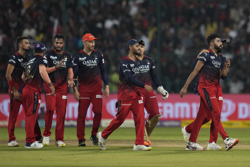 Royal Challengers Bangalore's players celebrate the wicket of Gujarat Titans' David Miller during the Indian Premier League cricket match between Royal Challengers Bangalore and Gujarat Titans in Bengaluru, India, Sunday, May 21, 2023. (AP Photo /Aijaz Rahi)