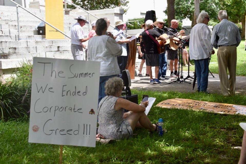 Referencing the Wilmington-shot hit show "The Summer I Turned Pretty," a sign displayed at a Saturday rally in support of the ongoing SAG-AFTRA strike reads "The Summer We Ended Corporate Greed."