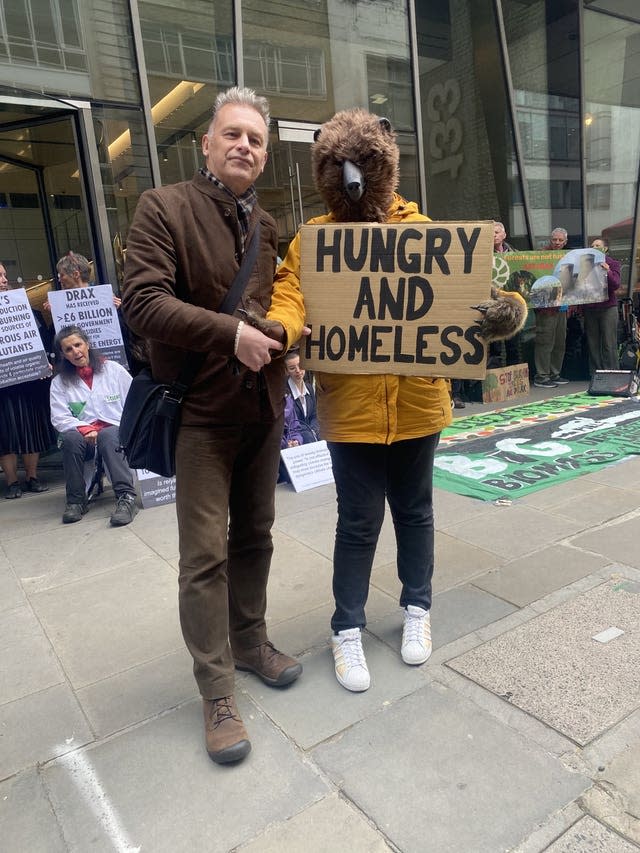 Chris Packham and members of the Axe Drax campaign group outside the Drax AGM