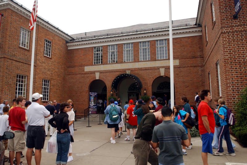 Lines begin to form in front of the Baseball Hall of Fame and Museum in Cooperstown, N.Y., on July 26, 2002. On February 2, 1936, the first class of inductees for the National Baseball Hall of Fame were announced, including Ty Cobb, Walter Johnson, Christy Mathewson, Babe Ruth and Honus Wagner. File Photo by Bill Greenblatt/UPI