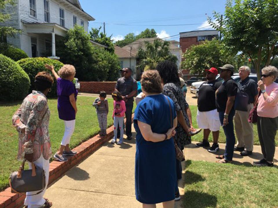 Dr. Valda Harris Montgomery with the Harris Home on Saturday, May 18, 2019.  This was part of the 58th anniversary of Freedom Rides with History Bus Tour.