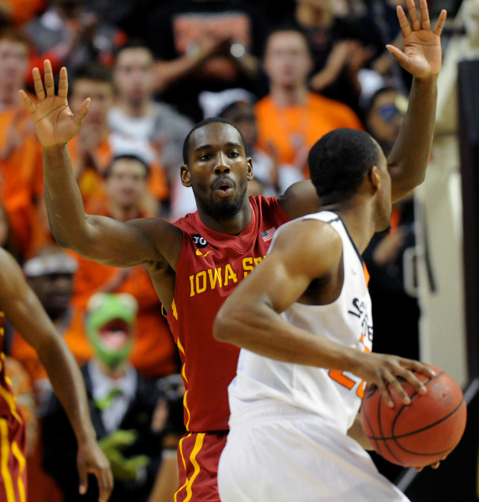 Iowa State guard DeAndre Kane, left, defends against Oklahoma State guard Markel Brown, right, during an NCAA college basketball game in Stillwater, Okla., Monday, Feb. 3, 2014. Kane scored 26 points in the 98-97 win over Oklahoma State. (AP Photo/Brody Schmidt)