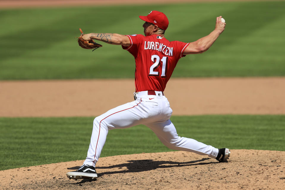 Cincinnati Reds' Michael Lorenzen (21) throws in the ninth inning during a baseball game against the Detroit Tigers at Great American Ballpark in Cincinnati, Sunday, July 26, 2020. (AP Photo/Aaron Doster)