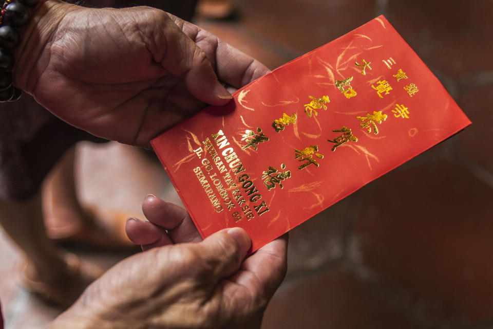 A donor seen holding a red envelope in Semarang City, Indonesia on Jan. 31 2016. NurPhoto/Getty Images