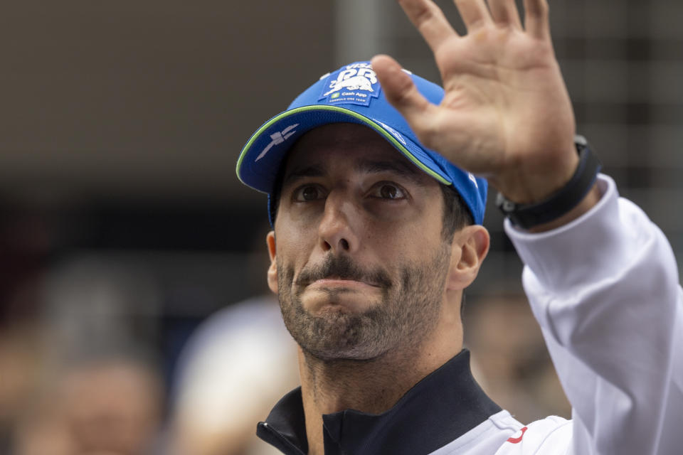 Daniel Ricciardo waves to fans.