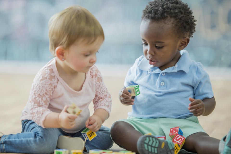 Two babies playing together