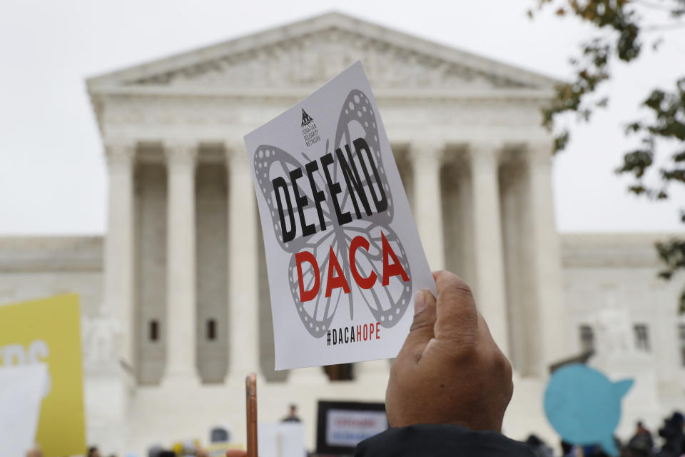 FILE - In this Nov. 12, 2019, file photo people rally outside the Supreme Court as oral arguments are heard in the case of President Trump's decision to end the Obama-era, Deferred Action for Childhood Arrivals program (DACA), at the Supreme Court in Washington. DACA recipients are assuming a prominent role in the presidential campaign, working to get others to vote, even though they cannot cast ballots themselves, and becoming leaders in the Democratic campaigns of Bernie Sanders and Tom Steyer as well as get-out-the-vote organizations. (AP Photo/Jacquelyn Martin, File)
