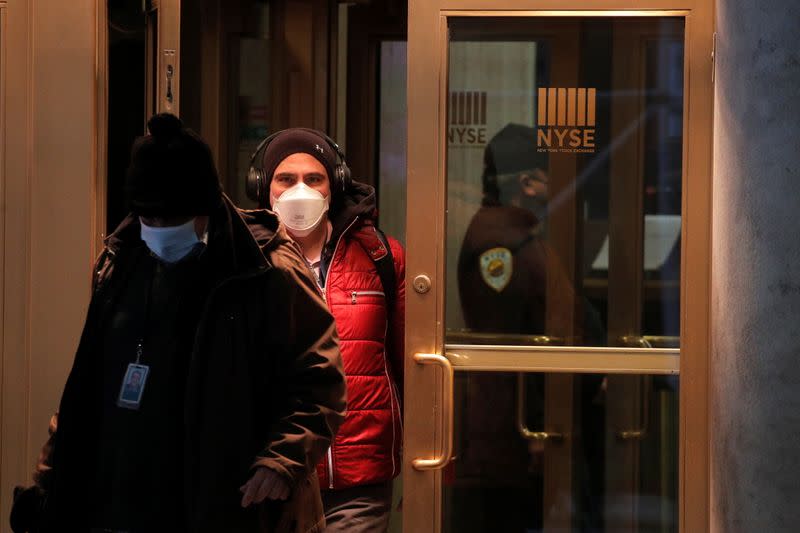 Traders exit the NYSE after the trading day in New York