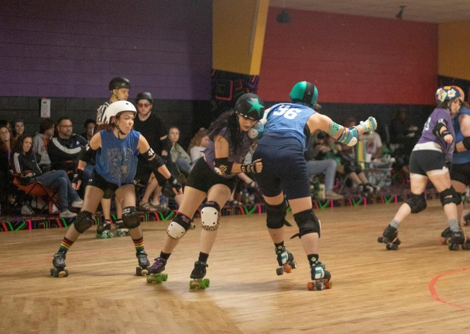 Classic City Rollergirls team member Kitty In Chains (center) leads a jam in Athens, Ga. on Dec. 3, 2023. The Rollergirls' 2024 season opener is scheduled for Sunday, Apr. 7.