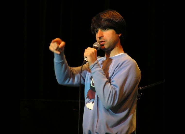 <a href="http://twitter.com/#!/demetrimartin" target="_hplink">@DemetriMartin</a>