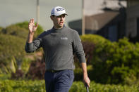 Patrick Cantlay reacts after making a birdie on the first green of the Pebble Beach Golf Links during the third round of the AT&T Pebble Beach Pro-Am golf tournament in Pebble Beach, Calif., Saturday, Feb. 5, 2022. (AP Photo/Eric Risberg)