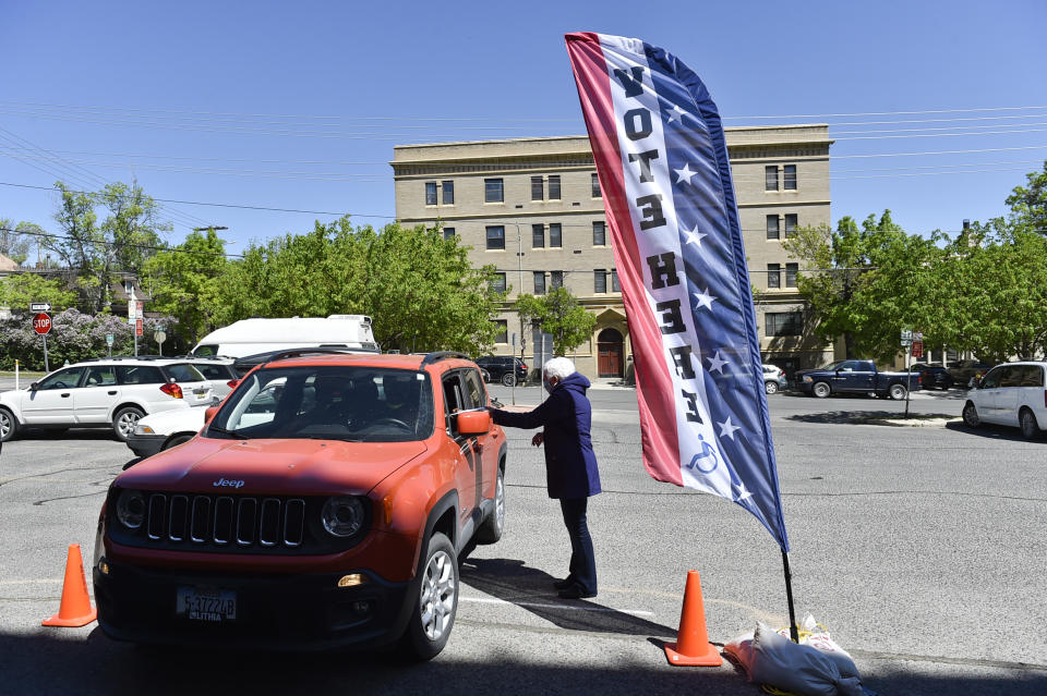 Voters drop off their ballots outside the City-County Building during Montana's primary election Tuesday, June 2, 2020 in Helena. Montana’s June 2 primary is being held by mail because of the coronavirus. (Thom Bridge/Independent Record via AP)