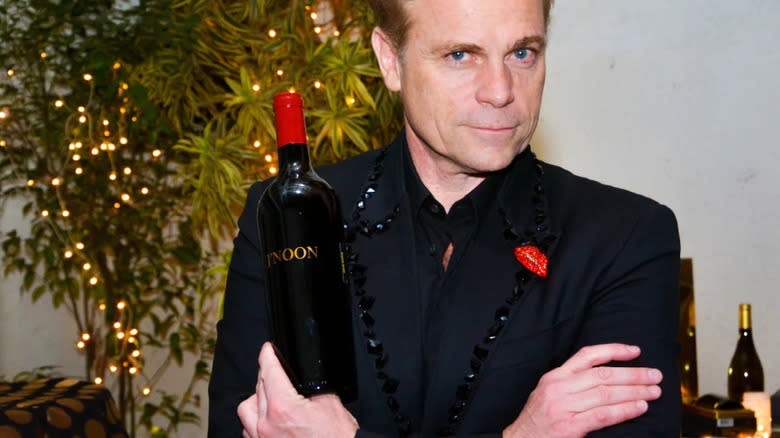 Jean-Charles Boisset holding a bottle of J'Noon 