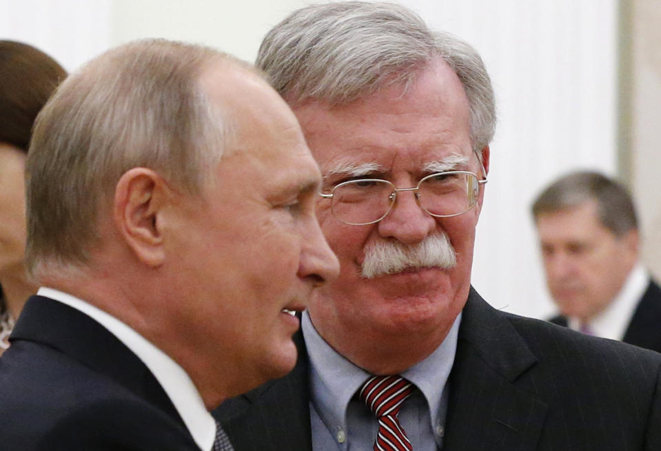 Russian President Vladimir Putin, left, and U.S. National security adviser John Bolton during their meeting in the Kremlin in Moscow, Russia, Tuesday, Oct. 23, 2018. (AP Photo/Alexander Zemlianichenko)