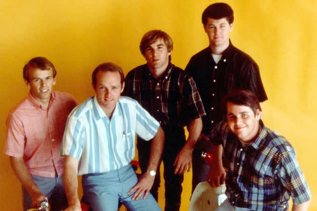 <p>Michael Ochs Archives/Getty</p> Al Jardine, Mike Love, Dennis Wilson, Brian Wilson and Carl Wilson of The Beach Boys in Los Angeles in 1964