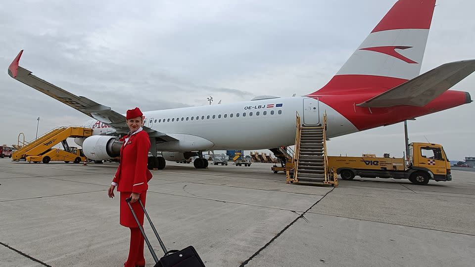 Fila recreated the childhood photograph as a newly qualified Austrian Airlines flight attendant. - Courtesy Gloria Fila