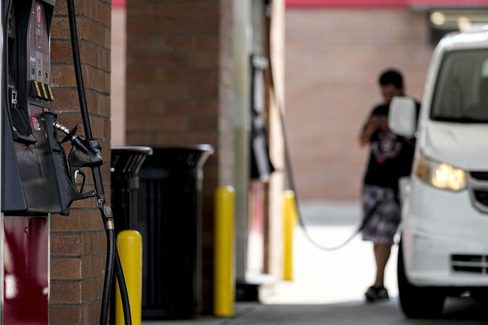 A person pumps gas, Tuesday, Sept. 12, 2023, in Marietta, Ga. Georgia's governor Brian Kemp is suspending state taxes on gasoline and diesel fuel, declaring a legal emergency over higher prices, Tuesday. (AP Photo/Mike Stewart)