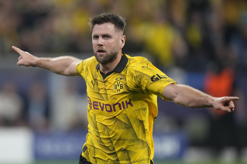 Dortmund's Niclas Fuellkrug celebrates after scoring his side's opening goal during the Champions League semifinal first leg soccer match between Borussia Dortmund and Paris Saint-Germain at the Signal-Iduna Park stadium in Dortmund, Germany, Wednesday, May 1, 2024. (AP Photo/Matthias Schrader)