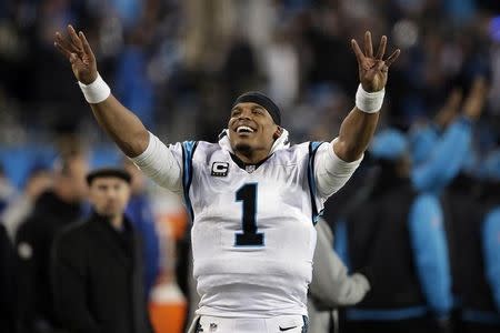 Jan 24, 2016; Charlotte, NC, USA; Carolina Panthers quarterback Cam Newton (1) celebrates on the side lines during the fourth quarter against the Arizona Cardinals in the NFC Championship football game at Bank of America Stadium.  Jeremy Brevard-USA TODAY Sports