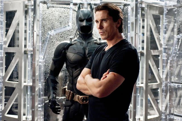 <p>Ron Phillips/Warner Bros./Everett</p> Christian Bale as Batman in "The Dark Knight."