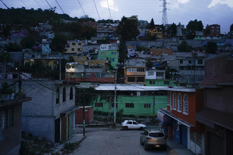 The sun sets in Naucalpan, State of Mexico, Mexico, Sunday, July 3, 2022. The State of Mexico ranks 10th among the country’s 32 states in femicides per 100,000 women. Dilcya García, who leads the Mexico state prosecutor’s office on gender violence, said the issue is part of the cement of Mexico’s social structure. (AP Photo/Eduardo Verdugo)