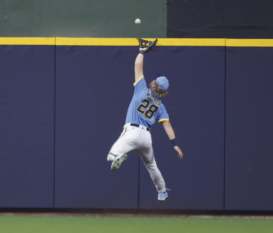 Milwaukee Brewers right fielder Joey Wiemer (28) catches a fly ball by Los Angeles' Chad Wallach during the fourth inning of a baseball game Friday, April 28, 2023, in Milwaukee. (AP Photo/Jeffrey Phelps)