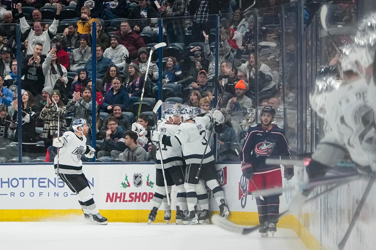 Dec 5, 2023; Columbus, Ohio, USA; Teammates celebrate a goal by Los Angeles Kings right wing Arthur Kaliyev (34) during the third period of the NHL game at Nationwide Arena. The Blue Jackets lost 4-3 in overtime.