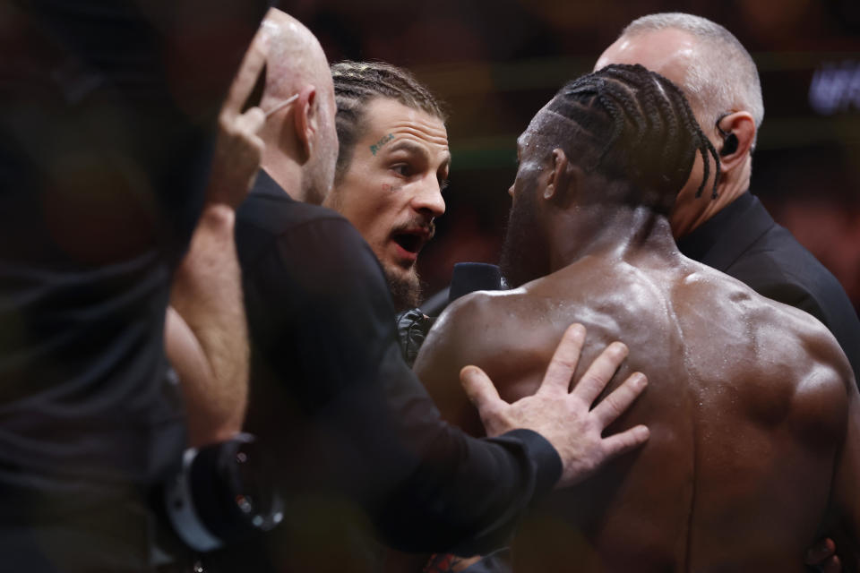 NEWARK, NEW JERSEY – MAY 06: Aljamain Sterling of Jamaica (right) exchanges words with UFC fighter Jorge Masvidal (left) after his bantamweight title bout against Henry Cejudo (not pictured) at UFC 288 at Prudential Center on May 06, 2023 in Newark, New Jersey. Sterling won by judge’s decision. (Photo by Sarah Stier/Getty Images)