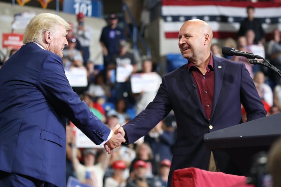 Donald Trump greets Pennsylvania gubernatorial candidate Doug Mastriano on Sept. 3, 2022. <a href="https://www.gettyimages.com/detail/news-photo/pennsylvania-republican-gubernatorial-candidate-doug-news-photo/1420631447?adppopup=true" rel="nofollow noopener" target="_blank" data-ylk="slk:Spencer Platt/Getty Images;elm:context_link;itc:0;sec:content-canvas" class="link ">Spencer Platt/Getty Images</a>