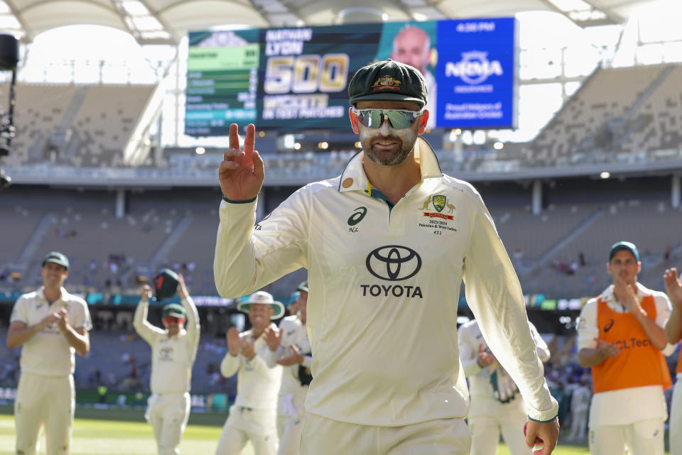 Australia's Nathan Lyon gestures as he leaves the field at the end of play on the fourth day of the first cricket test between Australia and Pakistan in Perth, Australia, Sunday, Dec. 17, 2023. Lyon took his 500th test wicket in Australia's 360 run win over Pakistan. (Richard Wainwright/AAP Image via AP)