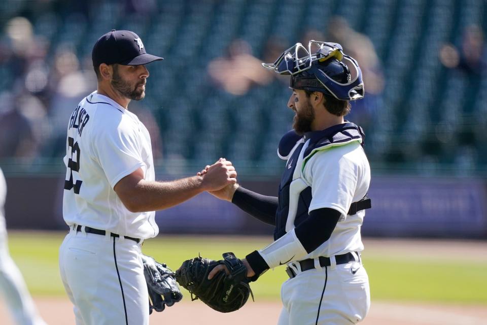 Detroit Tigers relief pitcher Michael Fulmer greets catcher Eric Hasse after saving the ninth inning of a baseball game against the Kansas City Royals, Thursday, May 13, 2021, in Detroit.