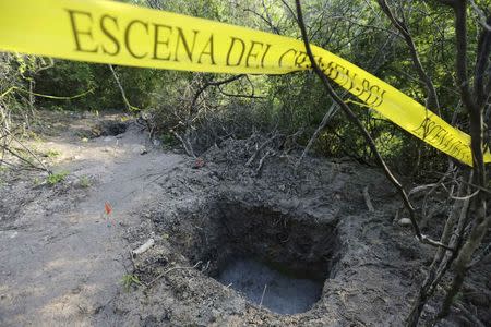 Clandestine graves are seen at Pueblo Viejo, in the outskirts of Iguala, southern Mexican state of Guerrero October 7, 2014. REUTERS/Henry Romero