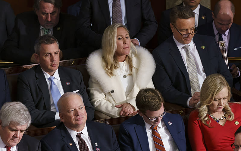 Rep. Marjorie Taylor Greene (R-Ga.) is seen as President Biden gives his State of the Union address to a joint session of Congress on Feb. 7. <em>Greg Nash</em>