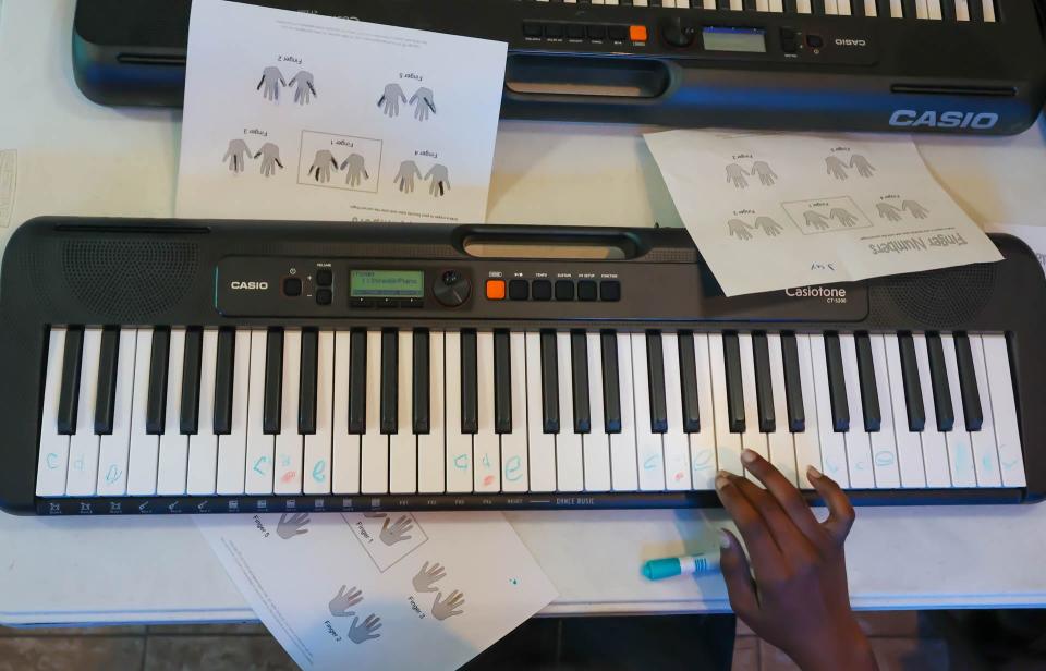 A student plays a sequence of notes during DUETkids piano lessons at Central Missionary Baptist Church in Hitch Village.