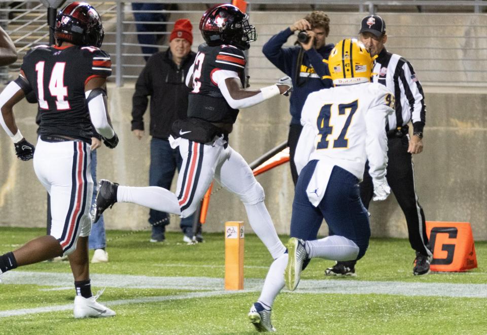 McKinley’s Nino Hill score a touchdown to give McKinley a 7-0 lead over St. Ignatius during the first quarter Friday, Nov. 3, 2023.