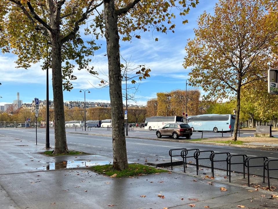 The street leading to the Eiffel Tower was lined with tour buses.