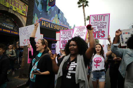 People participate in a protest march for survivors of sexual assault and their supporters in Hollywood, Los Angeles, California U.S. November 12, 2017. REUTERS/Lucy Nicholson