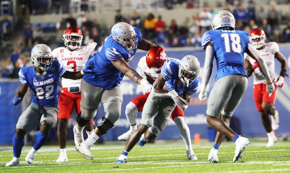 Memphis Tigers offense rushes the ball up the field against the Houston Cougars on Oct. 7, 2022 at Simmons Bank Liberty Stadium in Memphis.