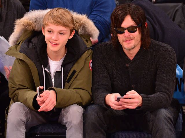 <p>James Devaney/GC Images</p> Norman Reedus and Mingus Reedus at Madison Square Garden in 2014