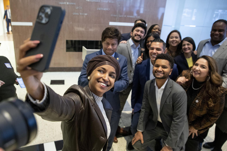 FILE - Members of the Congressional Progressive Caucus and other progressive candidates pose for a selfie taken by Rep. Ilhan Omar, D-Minn., at AFL-CIO headquarters in Washington, Nov. 13, 2022. (AP Photo/Amanda Andrade-Rhoades, File)