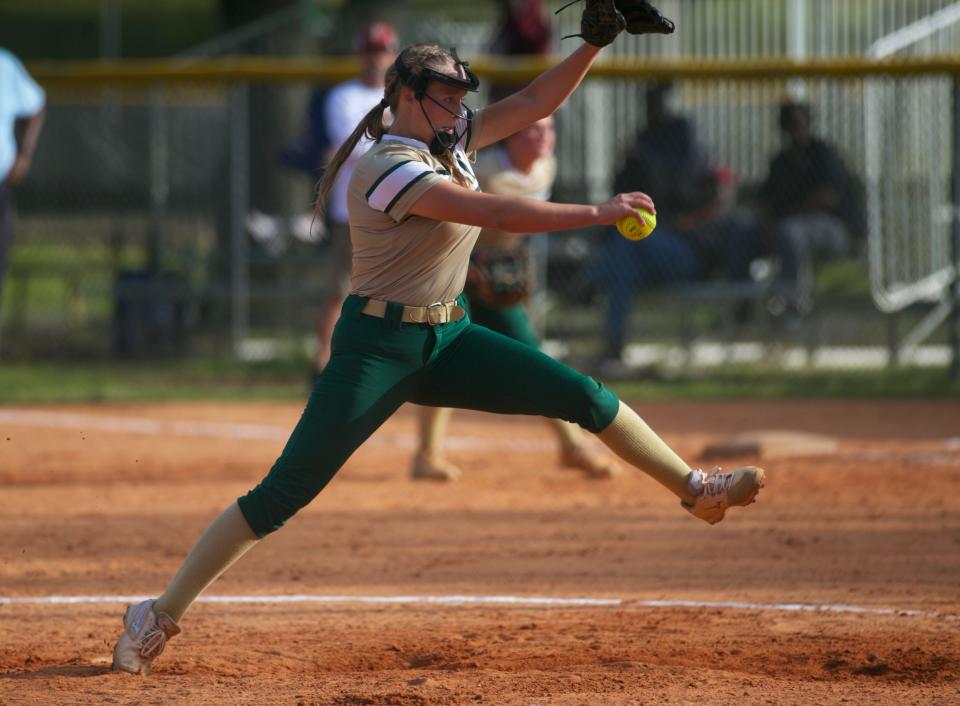 Lincoln senior pitcher Gwen McGinnis pitches the ball in a game against Florida High on April 11, 2022, at Lincoln High School. The Trojans won, 5-2.
