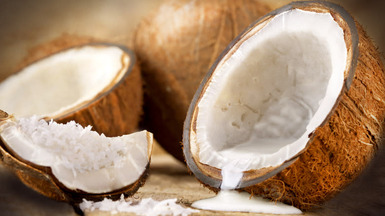 halved coconut and coconut milk