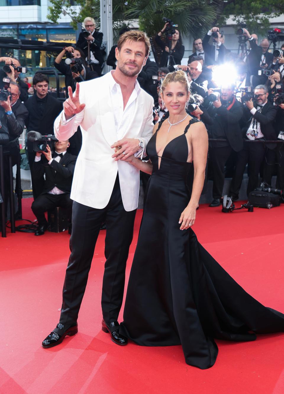 Image may contain: Chris Hemsworth, Elsa Pataky, Fashion, Adult, Person, Clothing, Footwear, Shoe, Accessories, and Jewelry